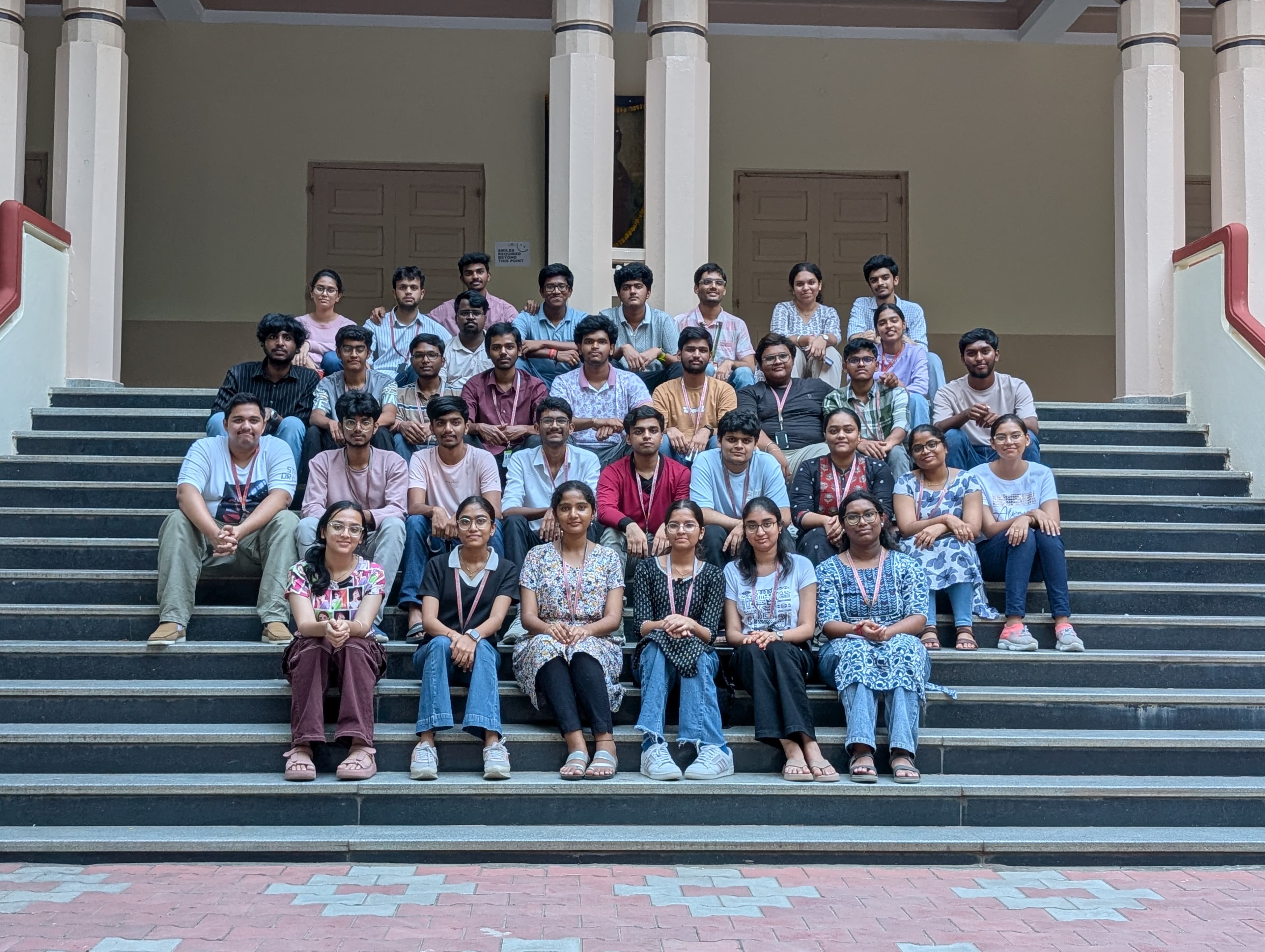Recurse members seated together on the campus steps